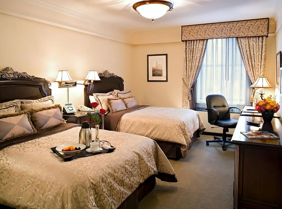 Wake up to breakfast in bed and soft, layered bedding.