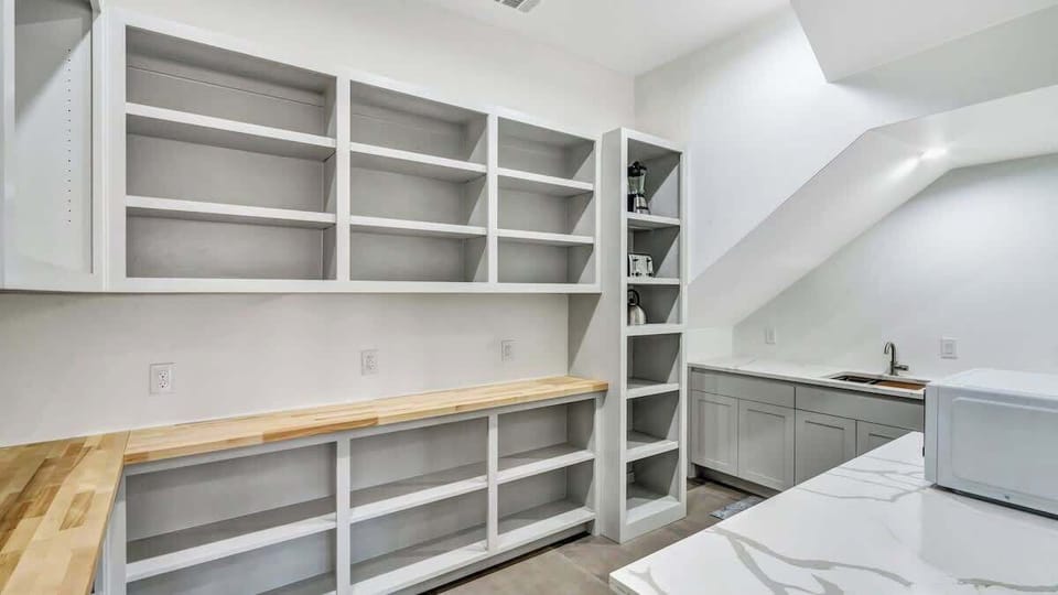 Stay organized and stress-free with this spacious pantry. Plenty of room for snacks, groceries, and meal prep essentials, so you can stock up and settle in. The perfect space to keep everything at your fingertips for effortless cooking & tailgating!