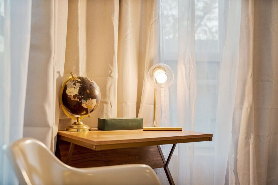 Work station surrounded by windows is a great place to work peacefully.