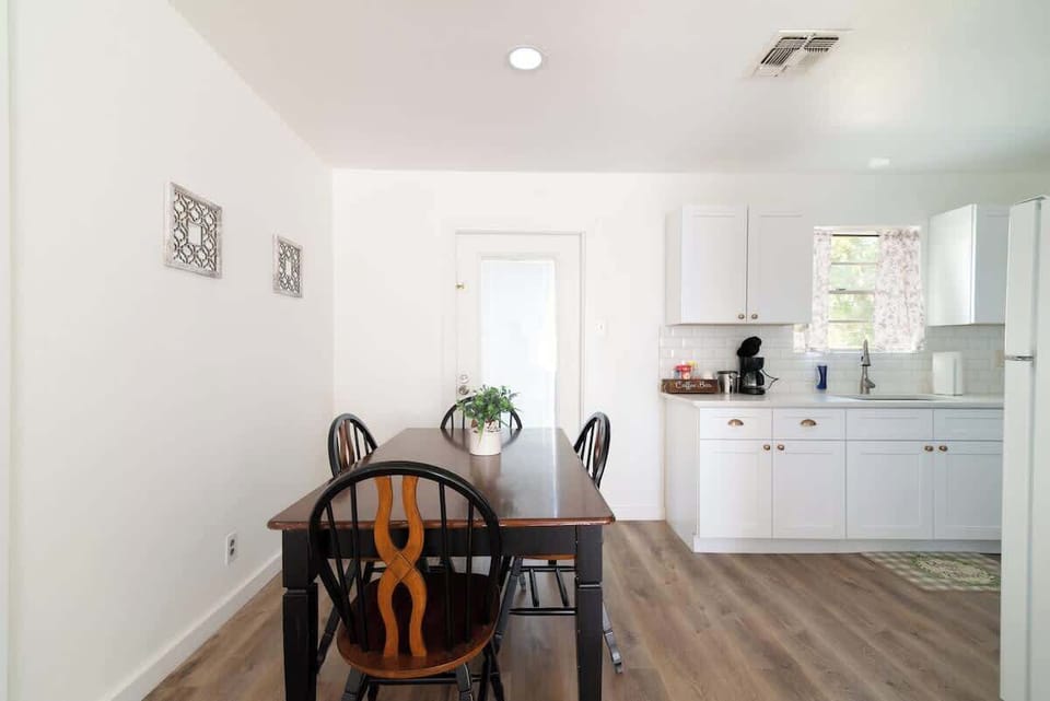 Bright and open dining space with modern finishes, perfect for sharing meals or working remotely.