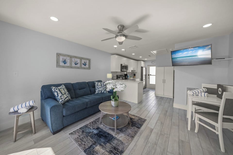 Relax in this bright, modern space where coastal blues meet crisp whites. Your open-plan living flows seamlessly into the full kitchen.