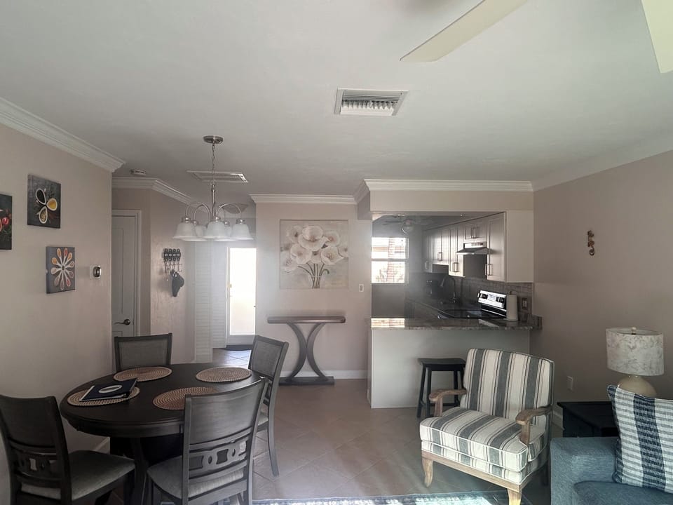 Your open-concept space seamlessly blends kitchen, dining, and living areas with modern finishes and thoughtful décor for comfortable gathering.