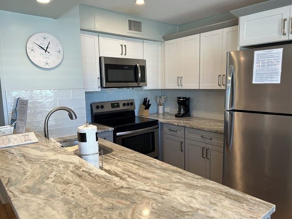 Your fully equipped kitchen awaits with stainless steel appliances, granite counters, and everything you need for memorable meals.