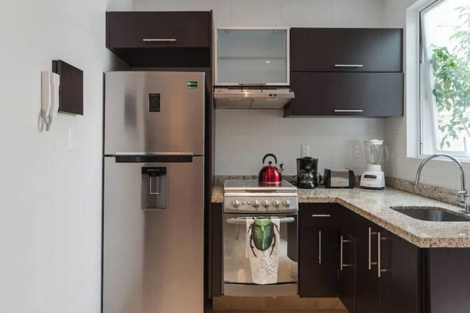 Refrigerator, stove, microwave, coffee maker, blender, utensils, cutlery, pots, pans