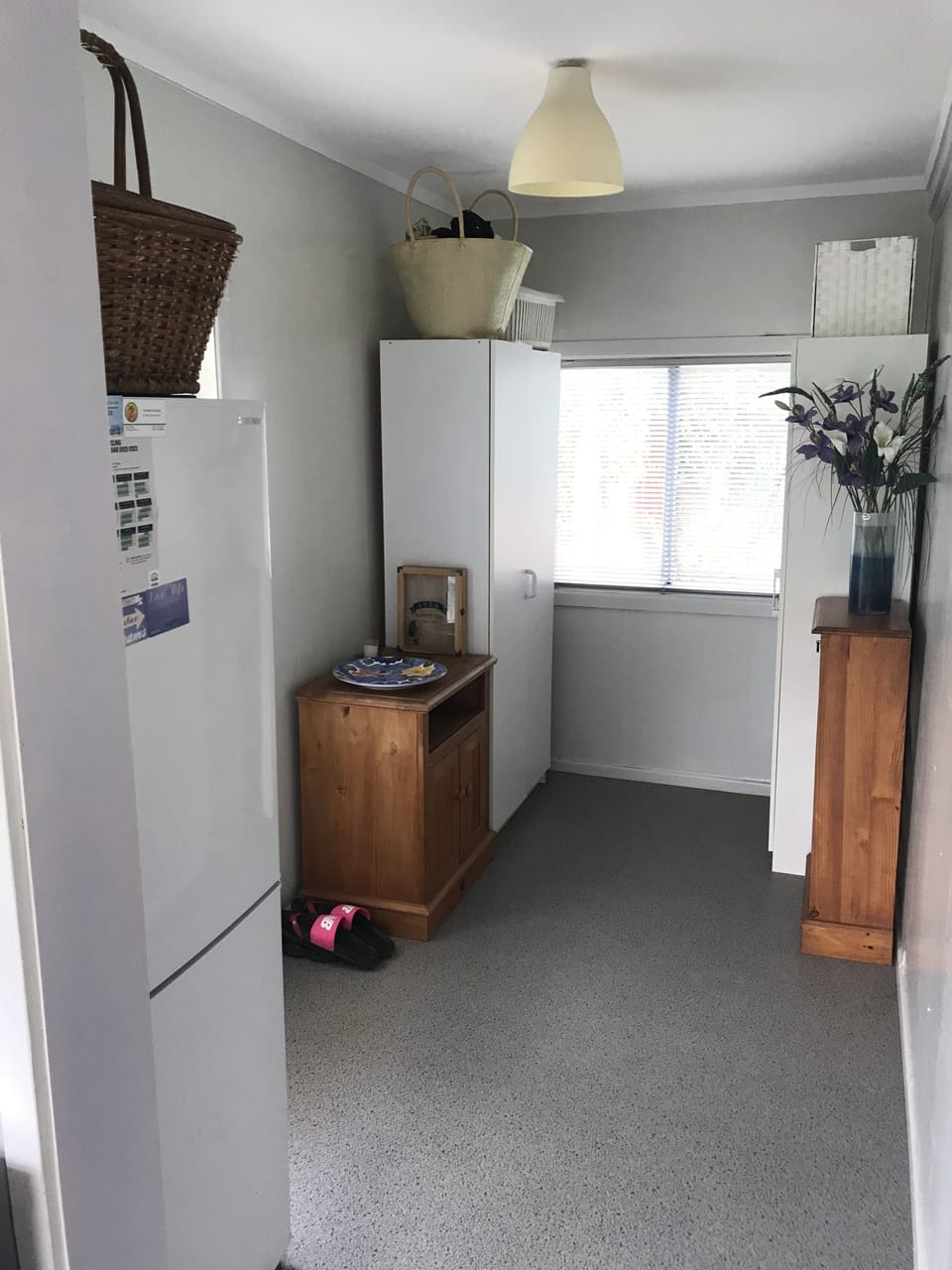 Rear area entry and utility adjacent to Kitchen.