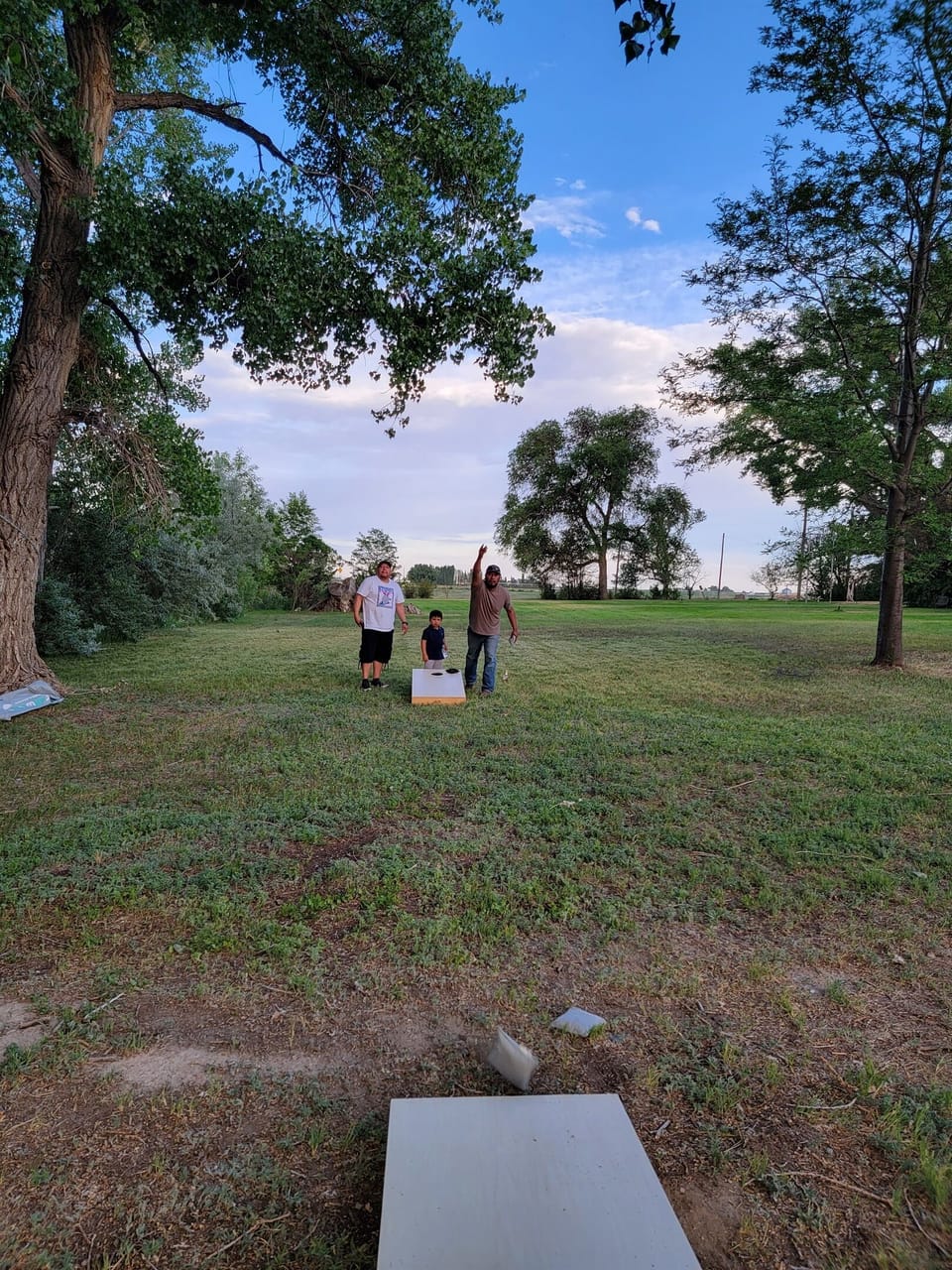 Laughter fills the air as friends and family gather together for games like corn hole, badminton, frisbee, even soccer!