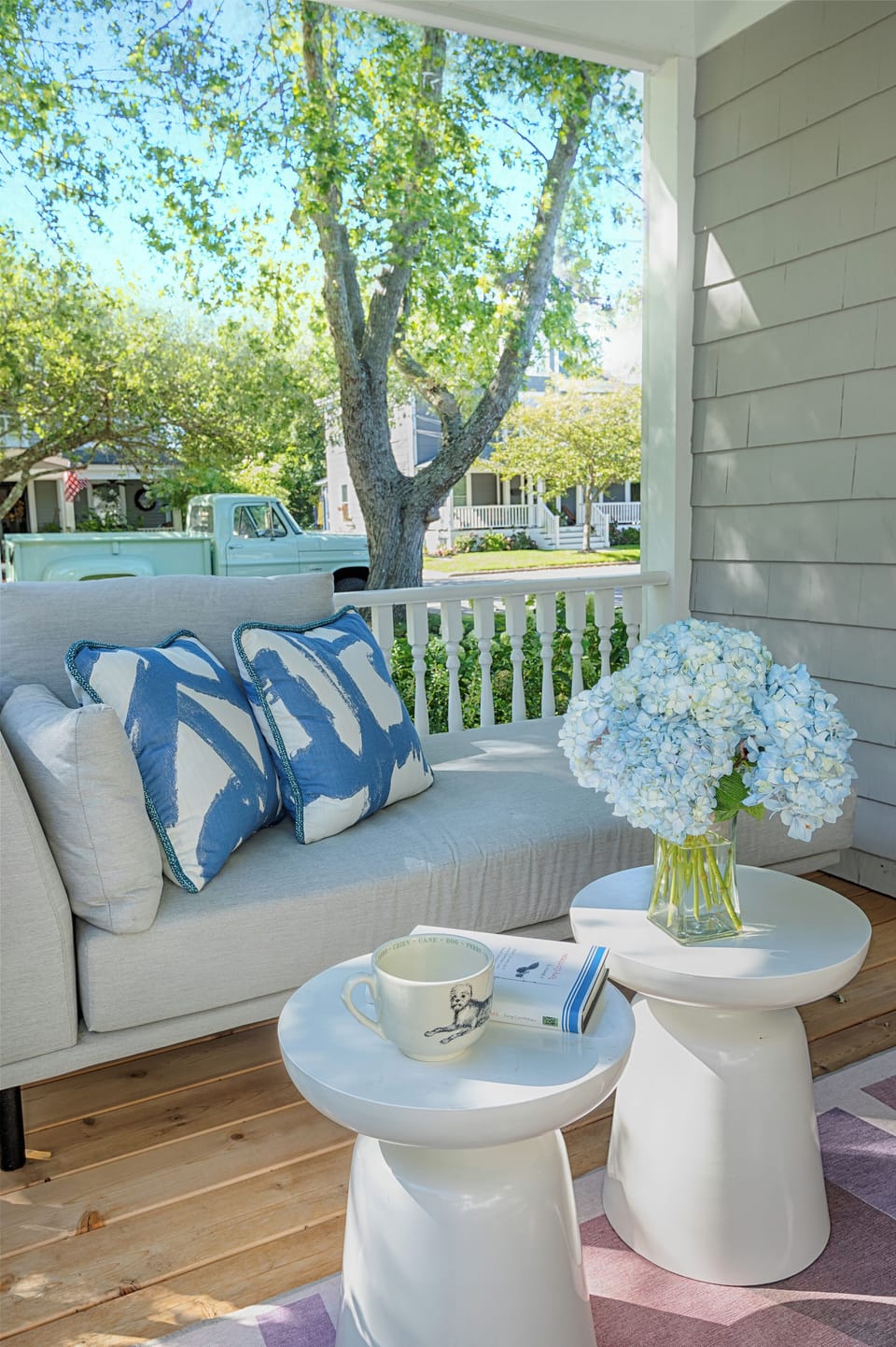 Side porch with two sofas 