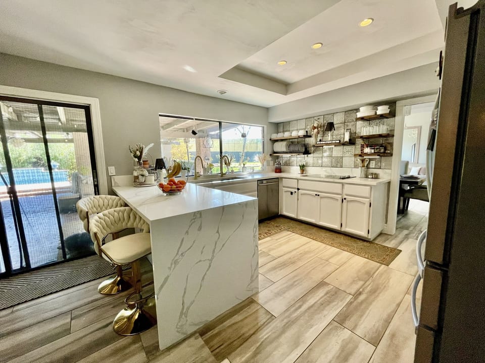 Beautifully remodeled kitchen with brand new quartz waterfall