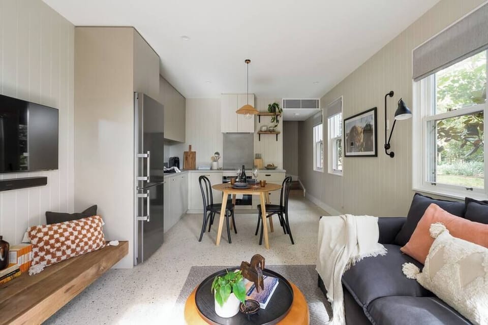 Combined dining and lounge with smart TV free wifi, gas fireplace, patio area and air-conditioning throughout. 