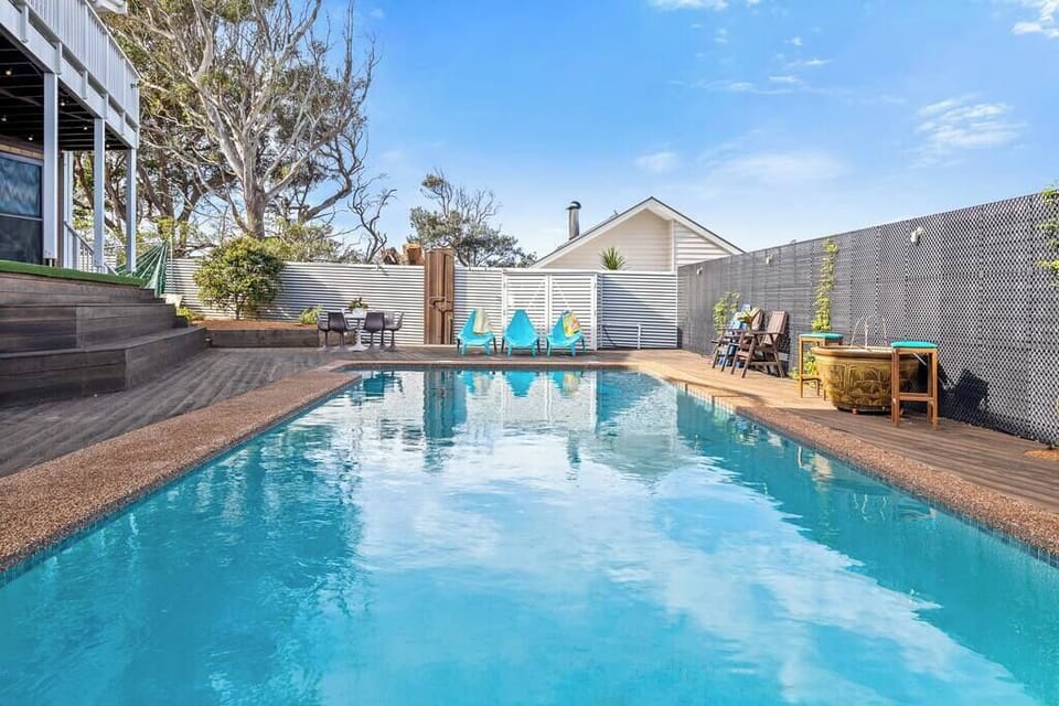 Outdoor entertaining area is a great place for summer evenings by the pool. The stunning pool and deck area is a perfect way to relax and have fun in the sun.  