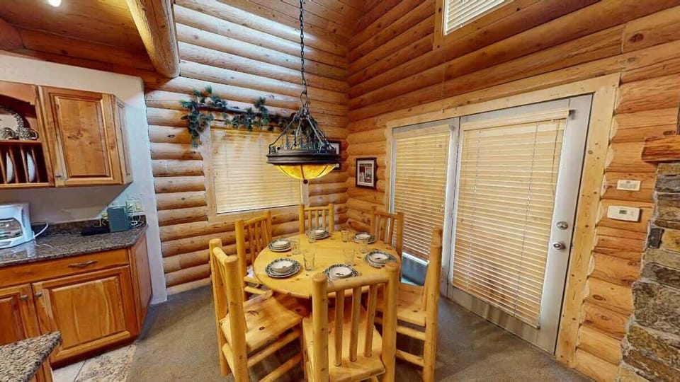 Dining room area with seats for 6  with additional seating at the kitchen island.