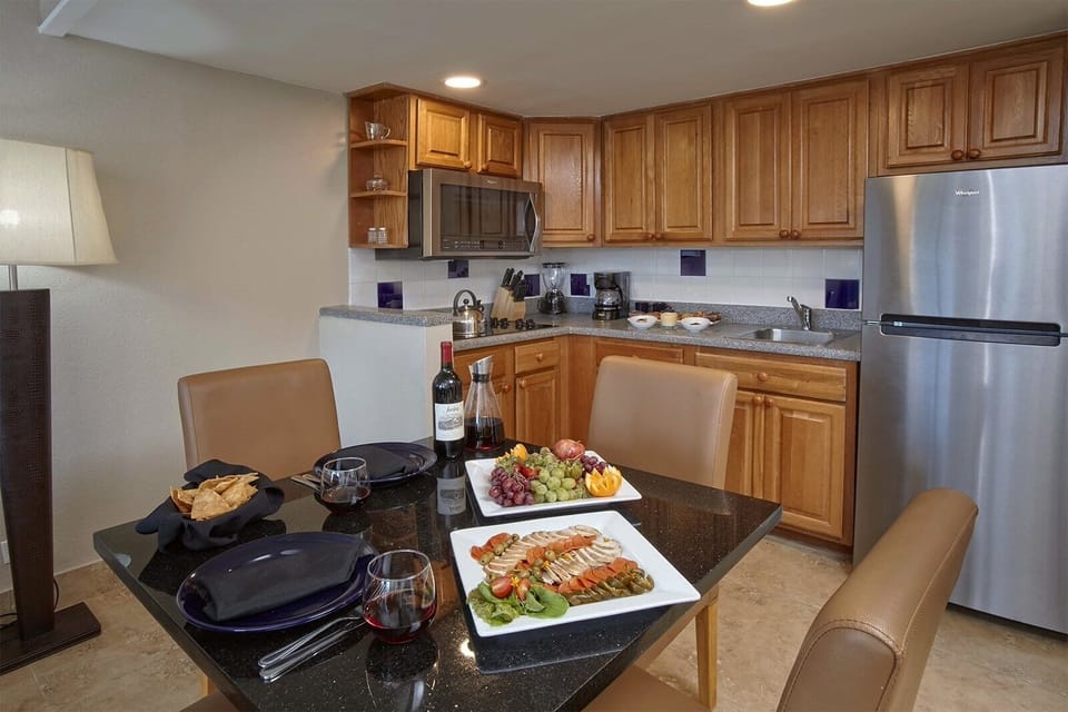 Serve up snacks and wine at the sleek dining table.