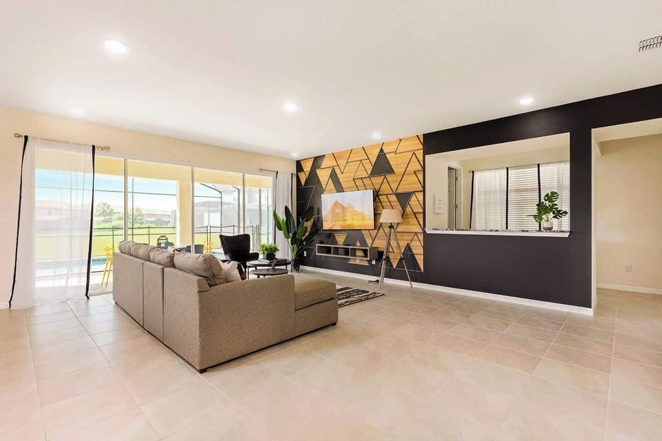 Modern living room with stylish decor and direct access to outdoor relaxation. Perfect for gatherings and entertainment.