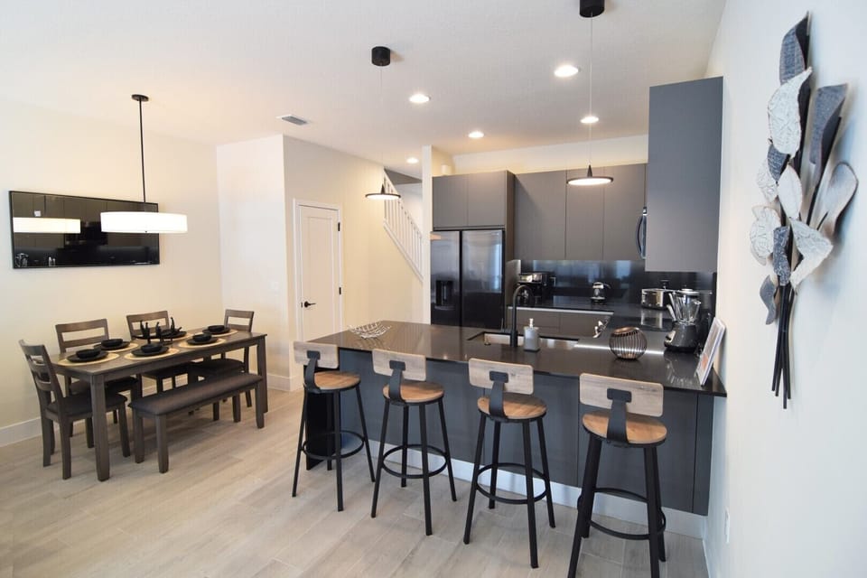 Stylish kitchen with large breakfast bar with stools