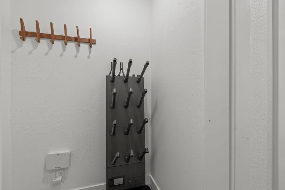 The entryway offers a comfortable bench and place to hang coats.