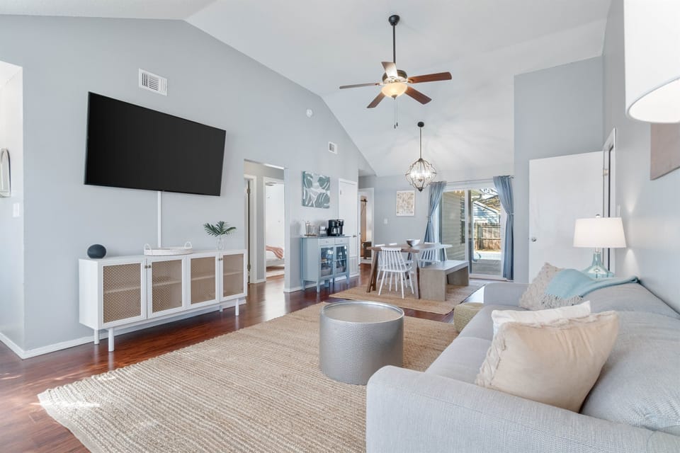 This area is open planned with the dining area and kitchen, the main hub of the house in all its glory. Also a stylish coffee table perfect for putting your snacks on