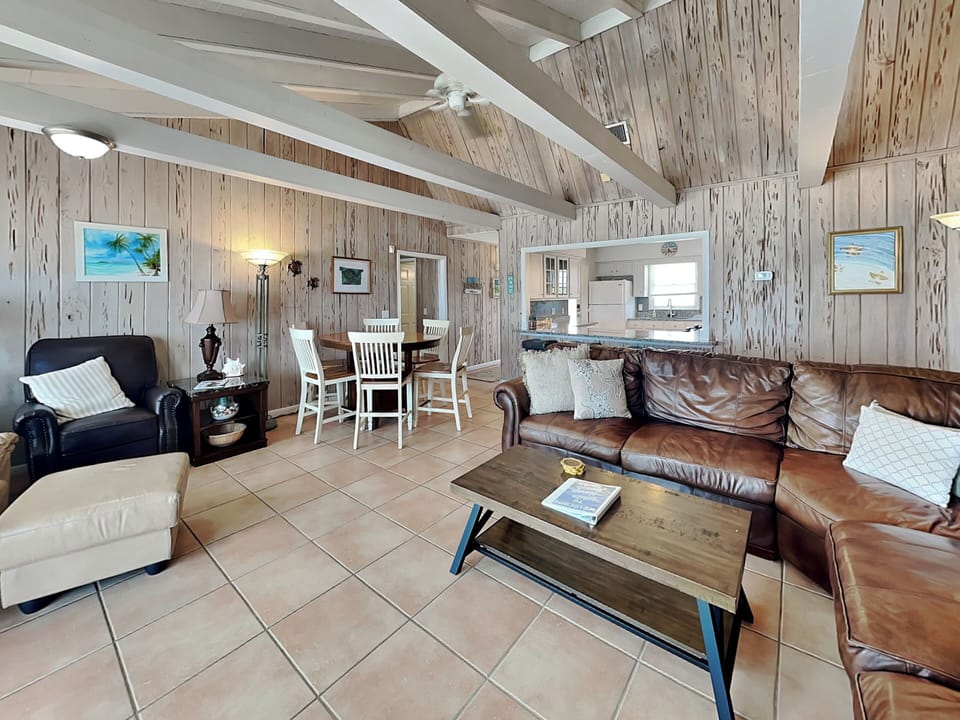 Open Concept Space - Balcony Access, Ocean Views, Dining Area + TV
