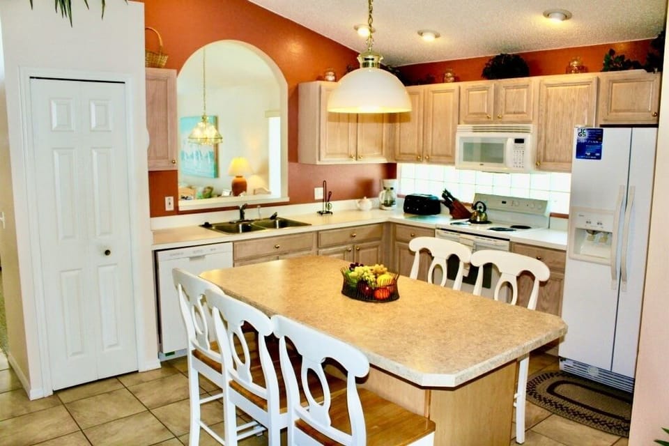A good sized breakfast table is in the kitchen