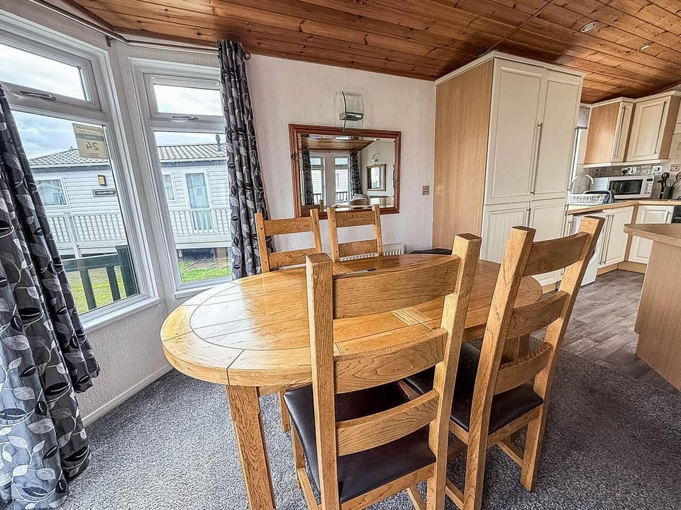 The dining table is perfect for everything from family breakfasts to evening board games, creating an inviting hub for socialising and dining on your UK family holiday.