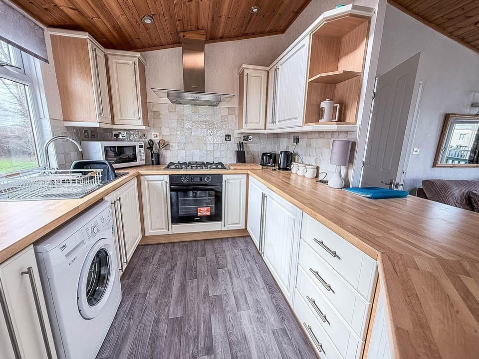 The kitchen, dining, and lounge areas are seamlessly connected, creating a wonderfully social and inviting atmosphere for everyone to unwind after your day out in Hunstanton.