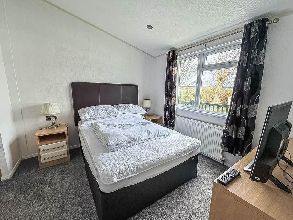 Designed for both comfort and practicality, this lodge bedroom offers a cosy retreat after a day exploring Hunstanton