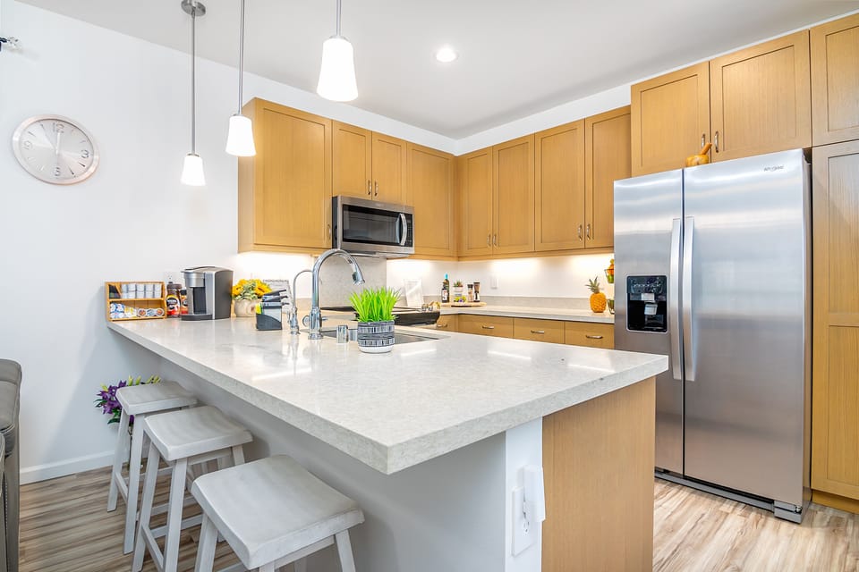Chef-ready layout with stainless appliances and sleek wood cabinetry!