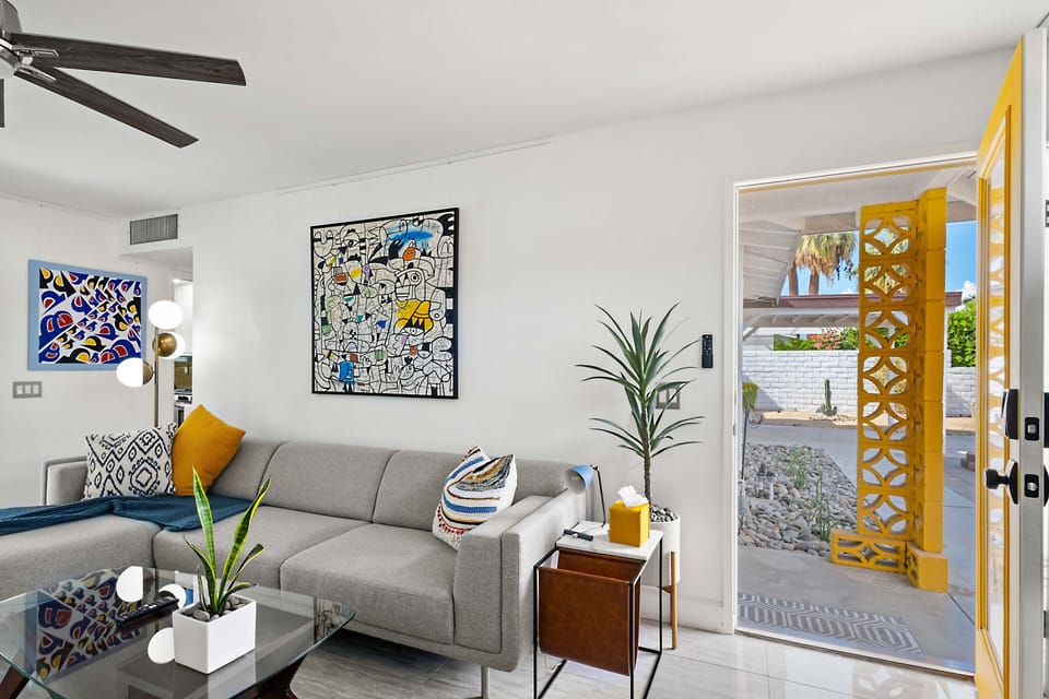 Living Room: Stylish Palm Springs house with vibrant mid-century decor and luxury amenities