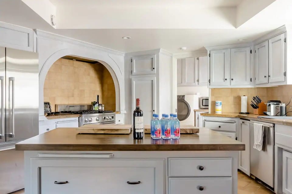 Master kitchen with ample supplies and kitchenware for gourmet cooking.