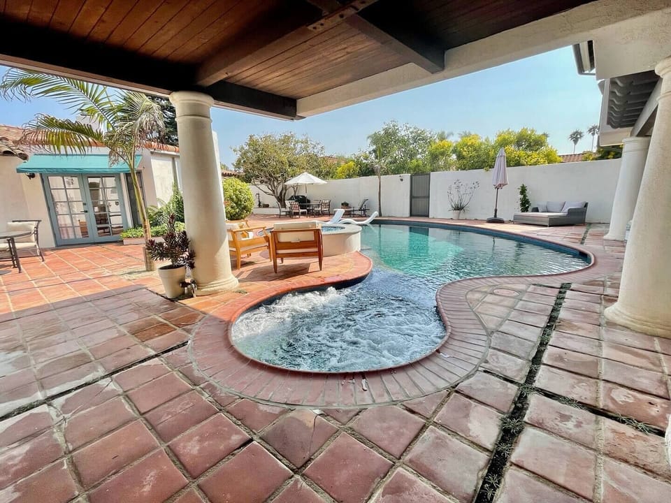 Covered spa and newly renovated saltwater pool.