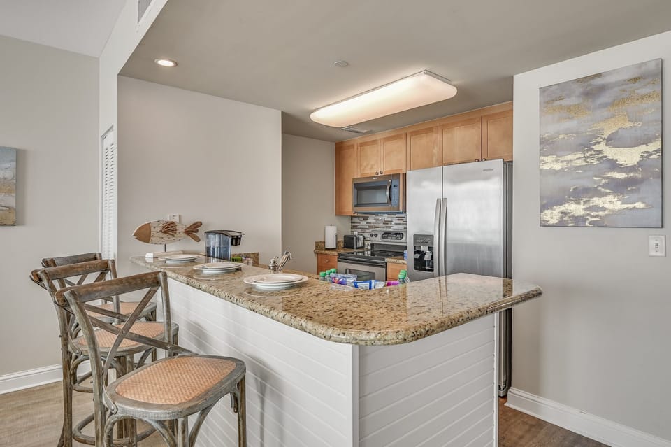The updated kitchen has granite countertops, stainless steel appliances, and is fully stocked with more than the basics (coffee/tea bar, oils/spices, Tupperware, plenty of pots/pans/cookware) so you and your group can prepare delicious Gulf front meals!