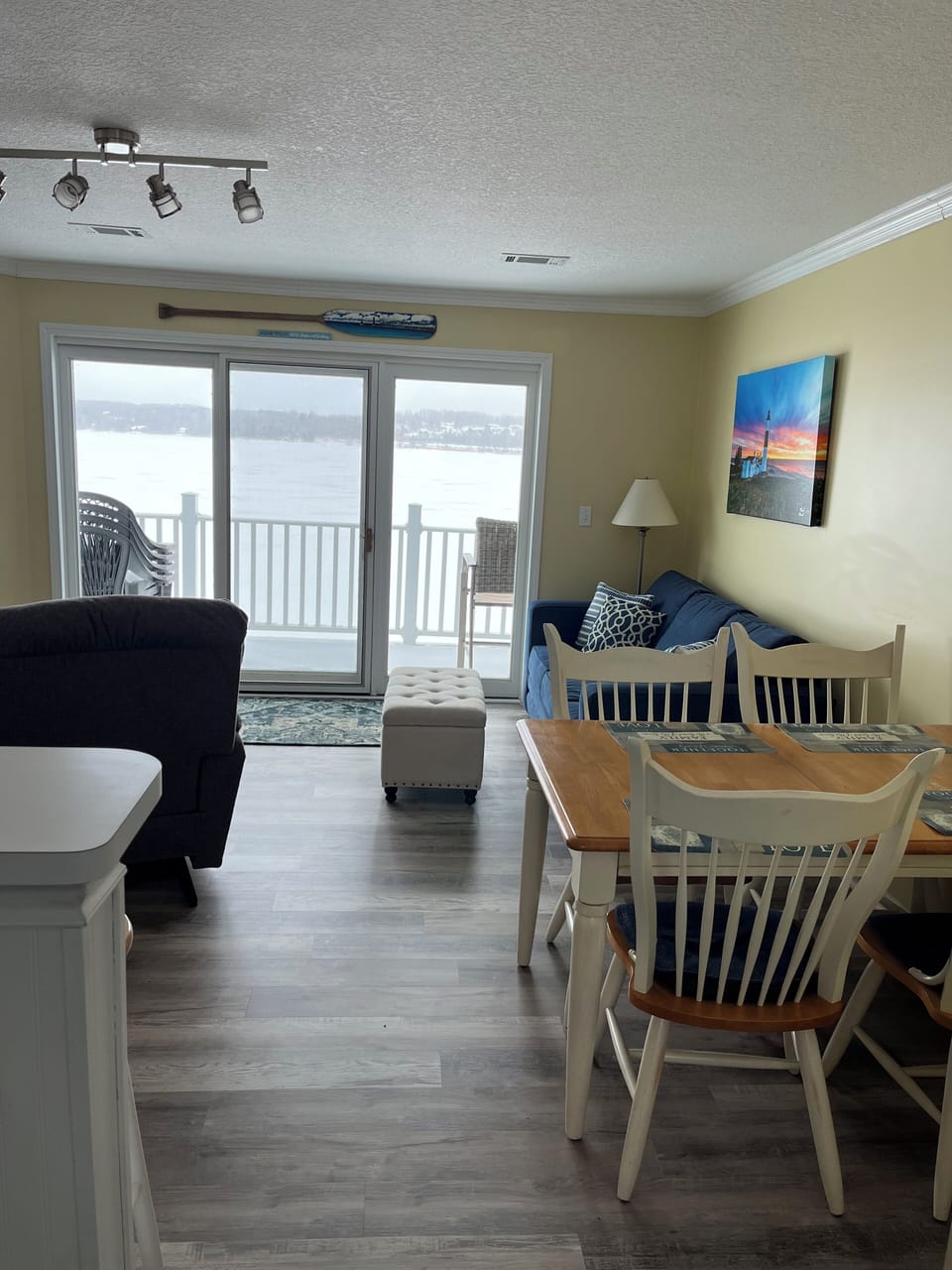 Fully updated living room overlooking the lake on a winter day.