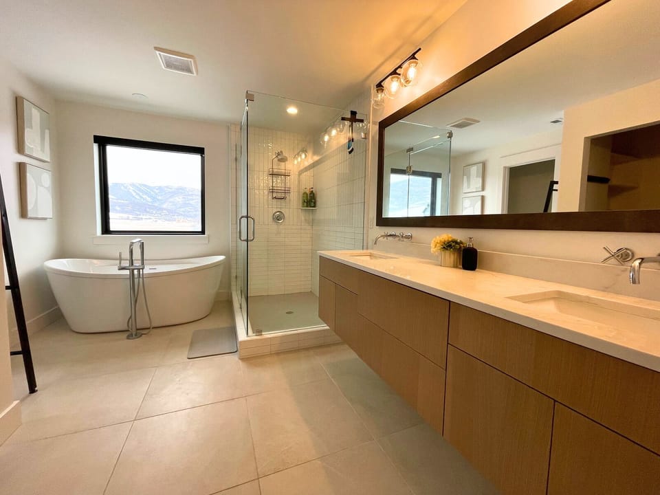 Master Bathroom has standing shower and soaking tub