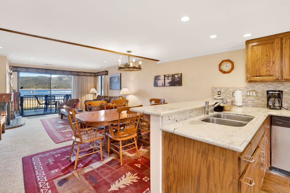 Fully equipped cabin kitchen with ample cabinetry, stove, fridge, microwave, and coffee maker—perfect for cooking meals, morning coffee, and feeling right at home on your stay.