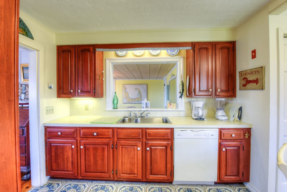 Kitchen with window looking into the dining room.