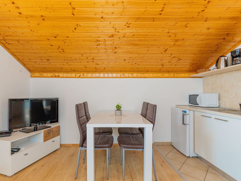 Furniture, Cabinetry, Wood, Table, Interior Design, Flooring, Home Appliance, Floor, Wood Stain, Living Room