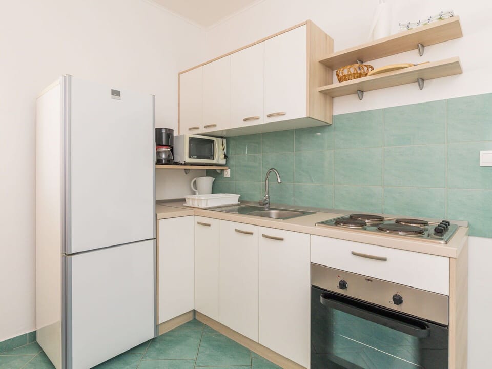 Cabinetry, Property, Countertop, Sink, Kitchen Appliance, Kitchen Stove, Kitchen Sink, Home Appliance, Tap, Interior Design