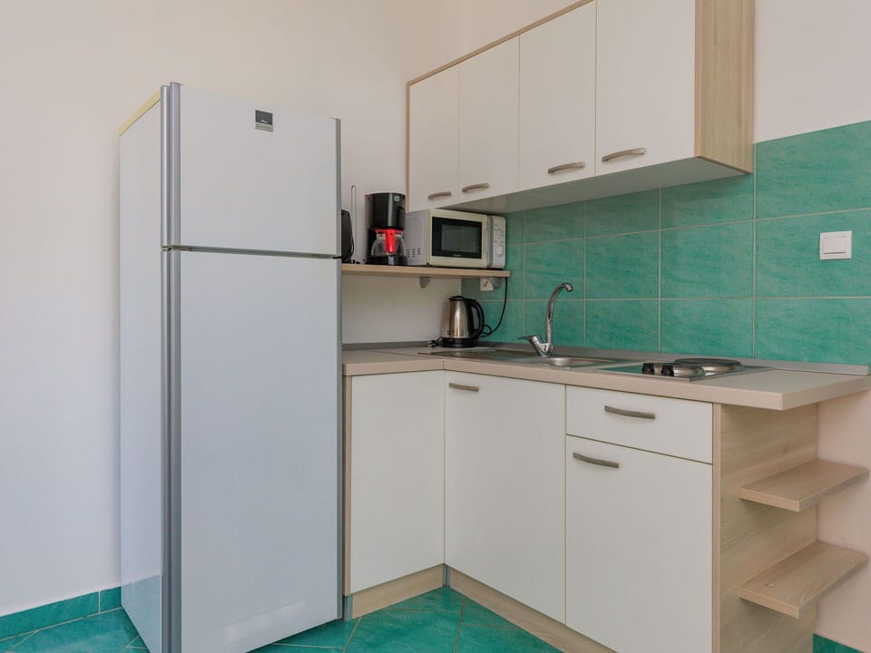 Sink, Kitchen Sink, Tap, Cabinetry, Countertop, Building, Kitchen, Kitchen Stove, Interior Design, Plumbing Fixture