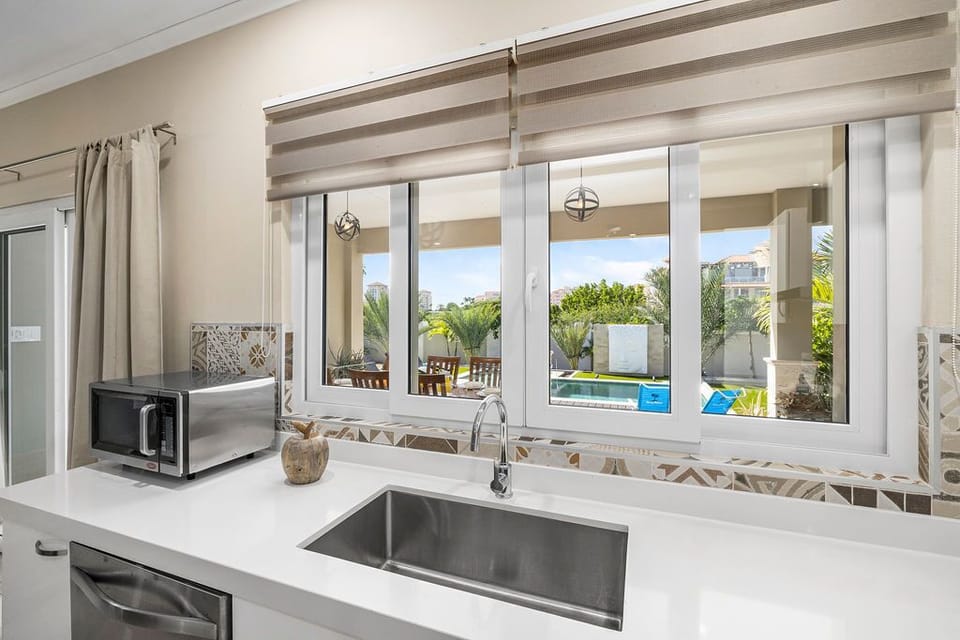 The kitchen sink window allows you to view the people in the pool area.