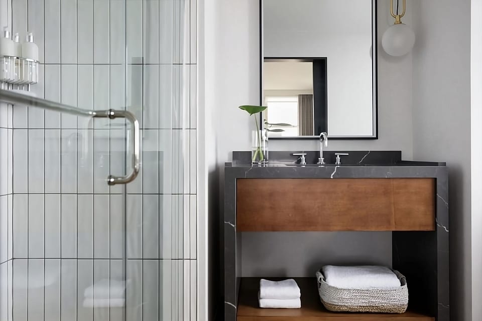 Rinse off in a glass shower with crisp, spa-like tiles.
