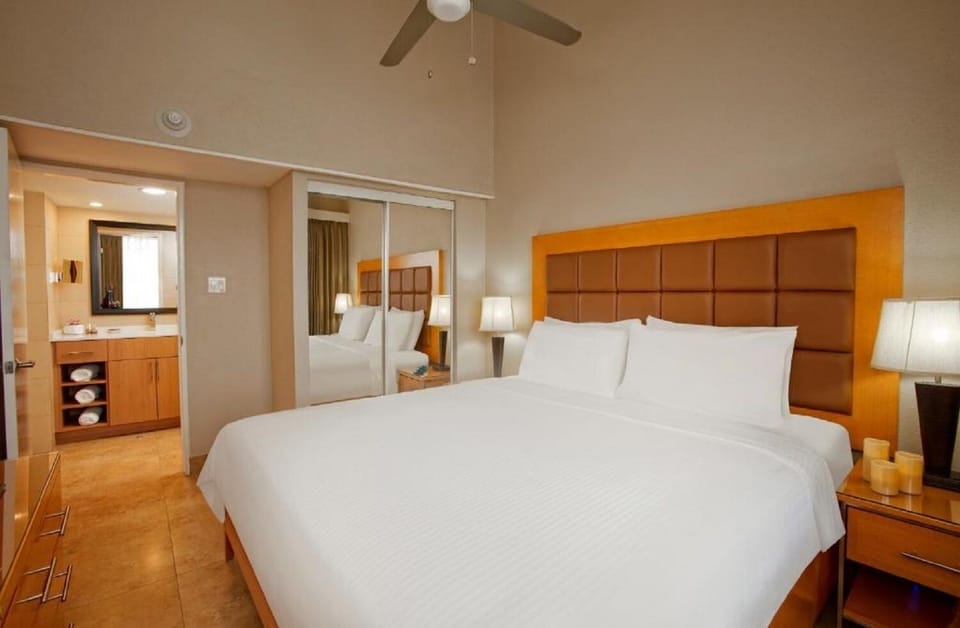 Drift off comfortably with bedside lighting and generous closet space.