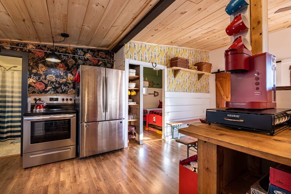 [Breakfast Nook, Downstairs] Savor the complimentary coffee and discover the array of board games tucked under the tabletop.