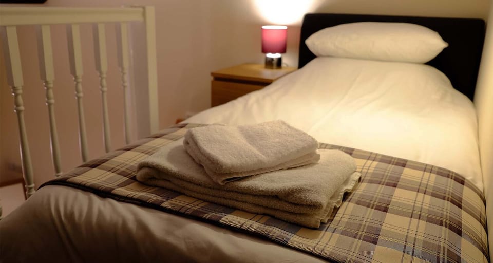 Single bed on mezzanine at Mid Wales Holiday Lets Bakehouse Apartment