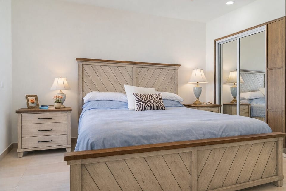 master bedroom with 2 closets and blanket storage