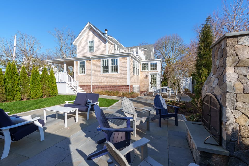 Backyard patio and fireplace. Privacy trees block Fuller St. view.