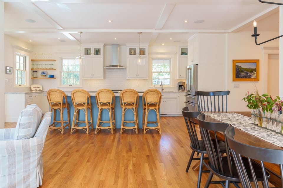 Kitchen: 2x drink fridges and 1x wine fridge located behind kitchen island.