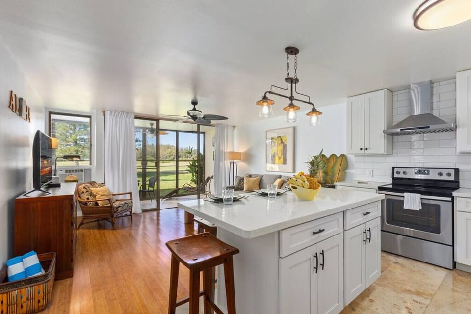Modern kitchen glowing w/ fresh light for effortless meal prep.