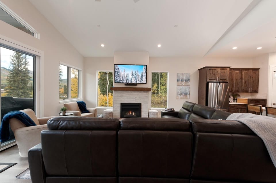 Main Living Space - TV, Gas Fireplace, Main Deck access and views