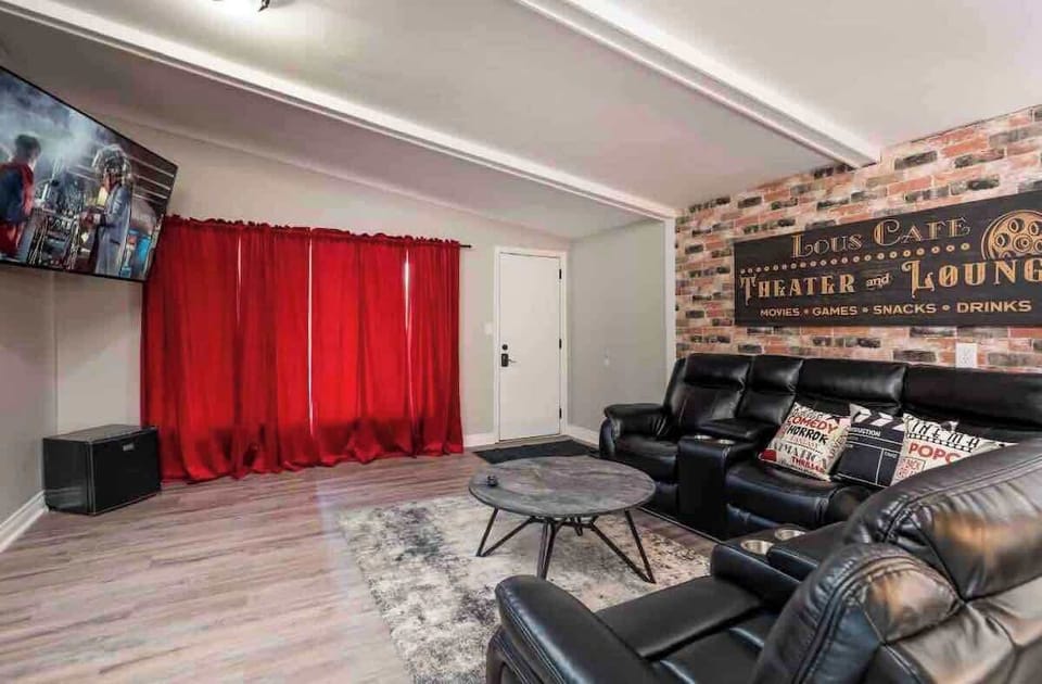 Living room with 65” Roku Smart Tv