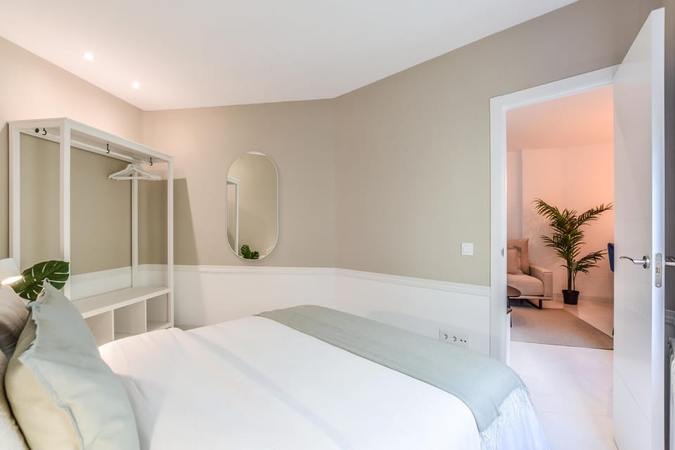 Main view of one of the bedrooms with double bed and cabinet furniture