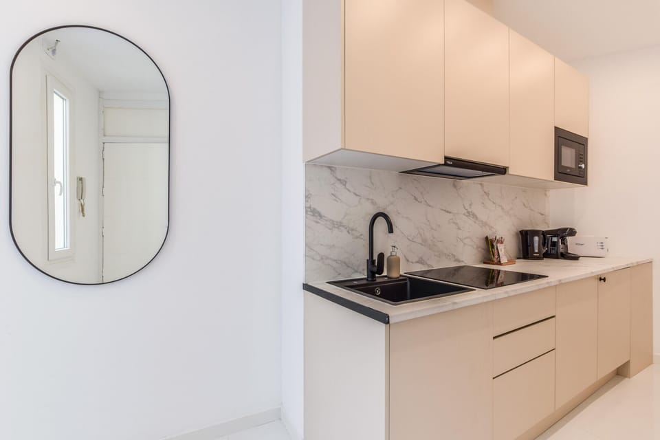 Main view of the kitchen space with appliances